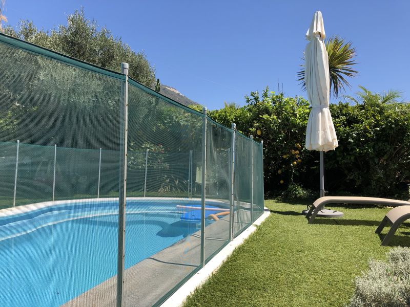 Mesh Fence Secured Around Pool